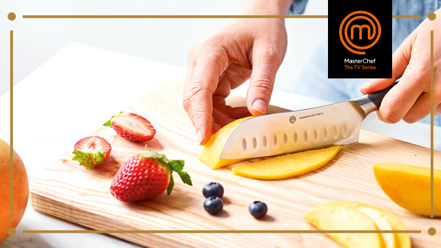 Close up of someone cutting Mangos with a MasterChef Knife