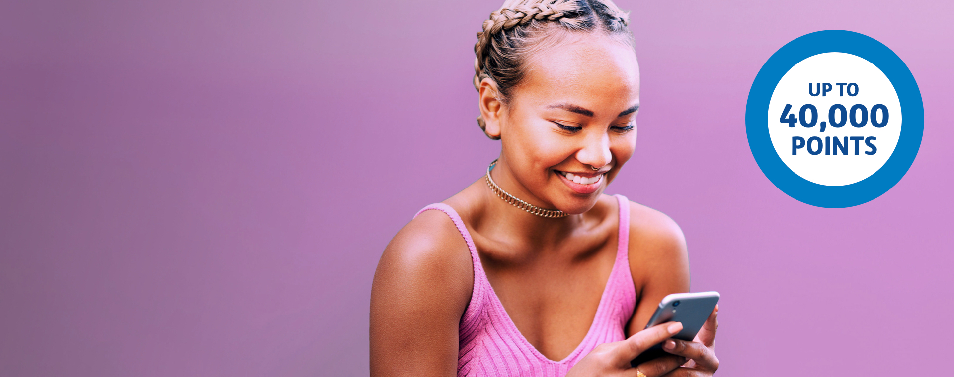 Girl looking at phone with an Up to 40,000 points ring to the left