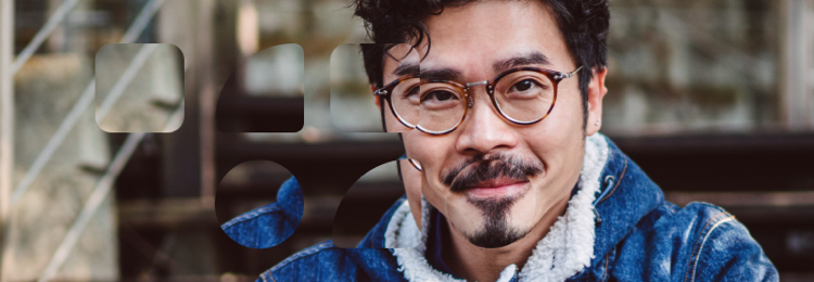 Guys with glasses checking his phone