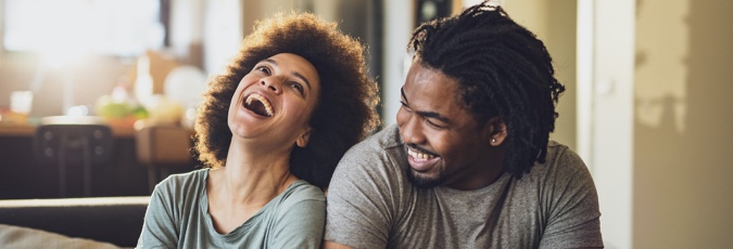 Score 100,000 Flybuys bonus points Young Cheerful African American Couple In The Living Room High-Res Stock Photo - Getty Images