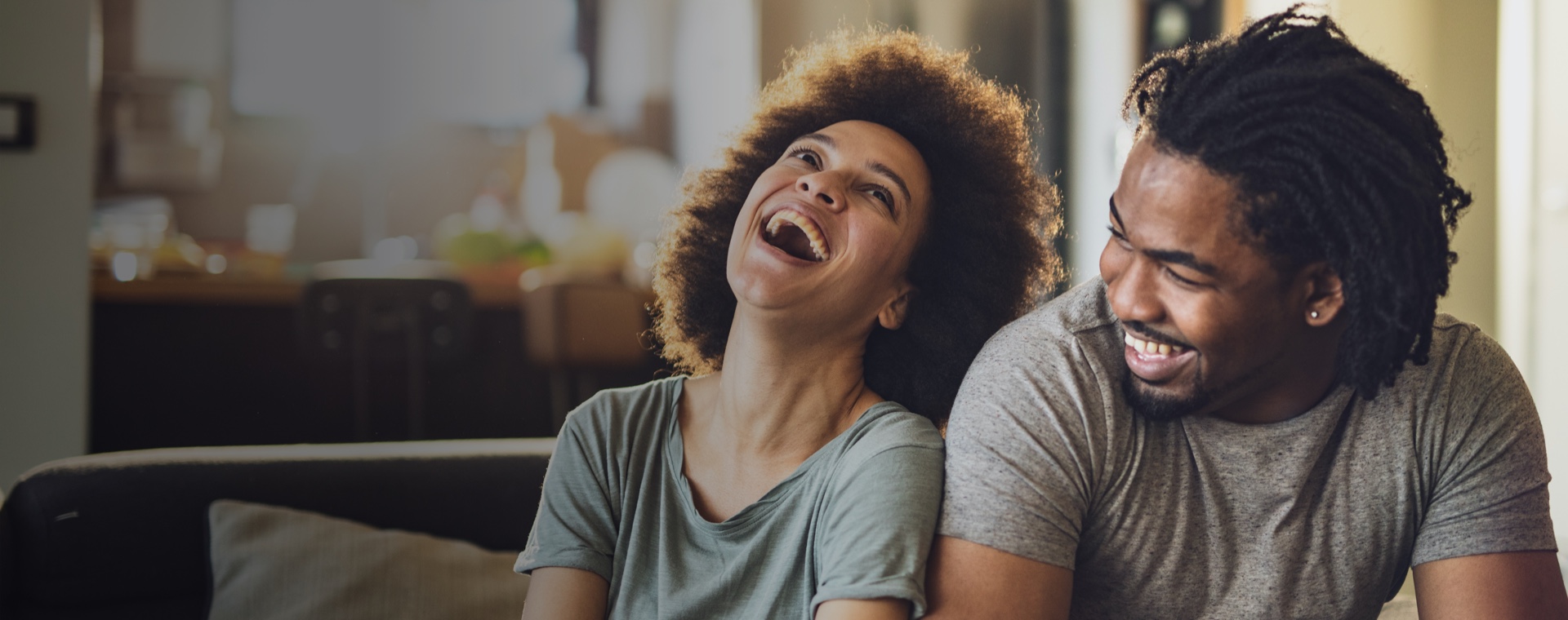Young Cheerful African American Couple In The Living Room High-Res Stock Photo - Getty Images