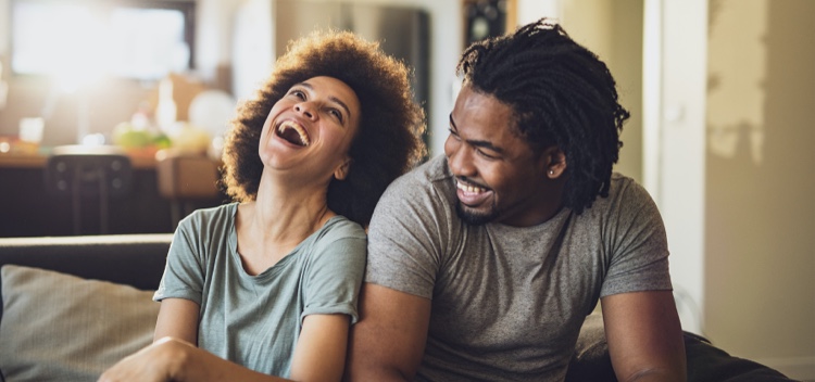 Young Cheerful African American Couple In The Living Room High-Res Stock Photo - Getty Images