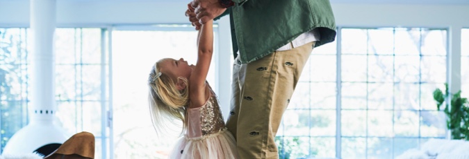 Citi Personal Loan Plus - enjoy 110,000 Flybuys bonus points Image of a father in a green shirt playfully lifting his daughter by her arms