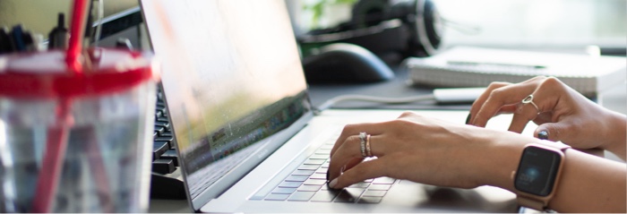 Clever Time Management Tips for Working From Home or Office A woman typing on a laptop computer
