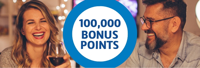 Score 100,000 Flybuys bonus points A woman and man smiling with 100,000 bonus points in blue text