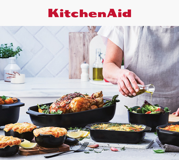 A range of KitchenAid kitchen products on a kitchen table