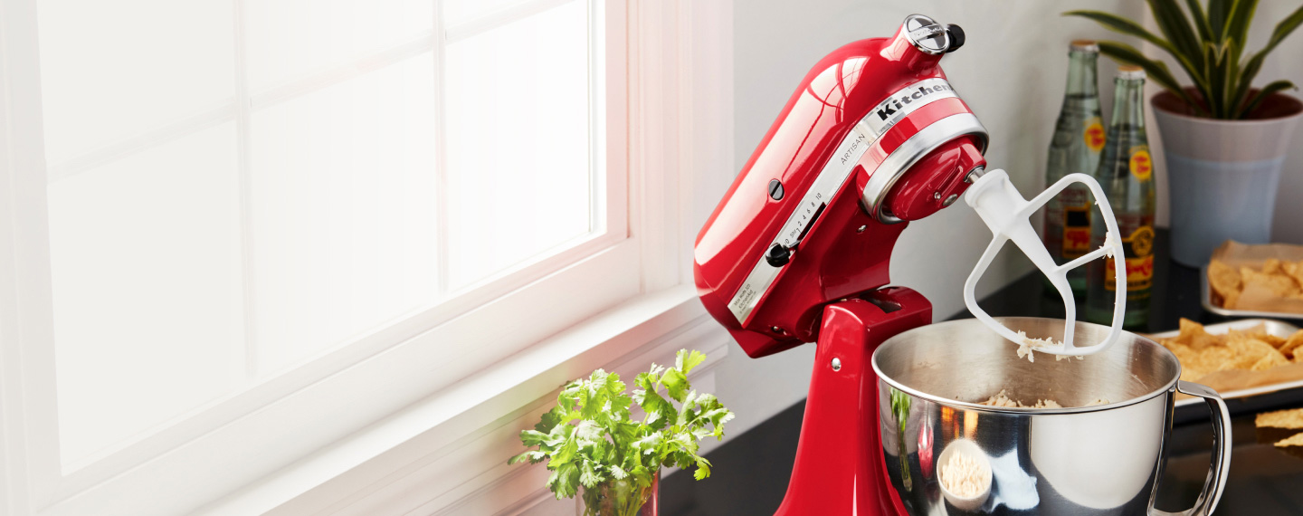 Image of a red KitchenAid Stand Mixer on a kitchen bench