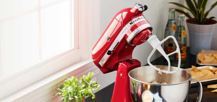 Image of a red KitchenAid Stand Mixer on a kitchen bench