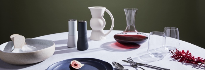 MAKE YOUR HOME A SANCTUARY Make your home a sanctuary. Beautiful table set with wine decanter, wine glasses, plates, cutlery, salad bowl, servers and water jug.