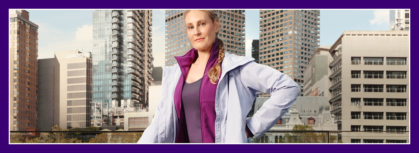 Flybuys' top 10 member Tess posing outside skyscrapers