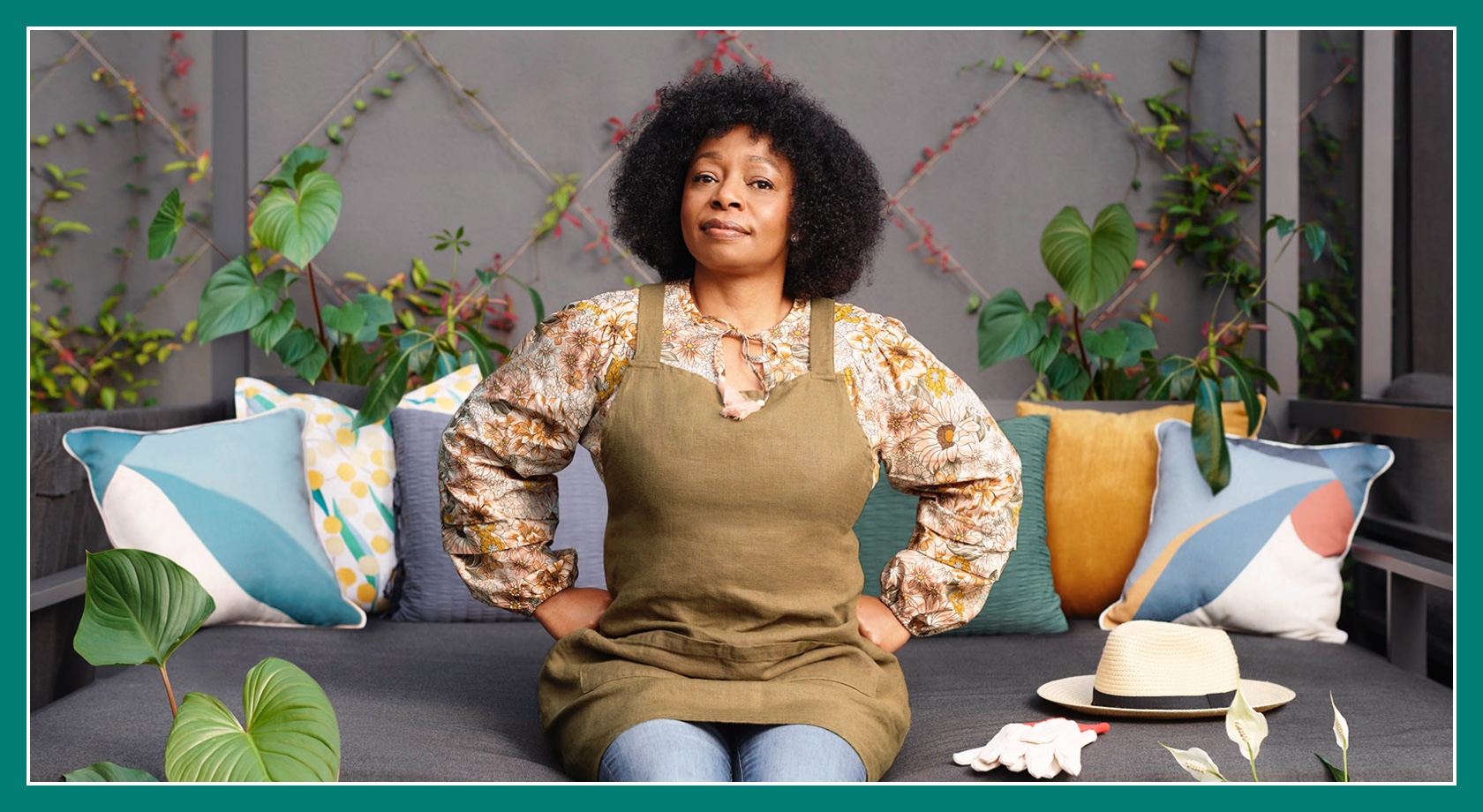 Flybuys' top 10 member Megan sitting on couch with arms on hips