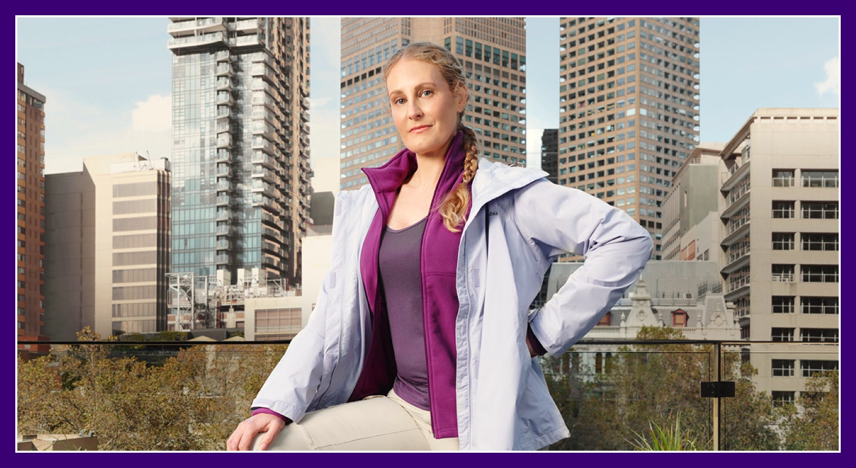 Flybuys' top 10 member Tess posing outside skyscrapers