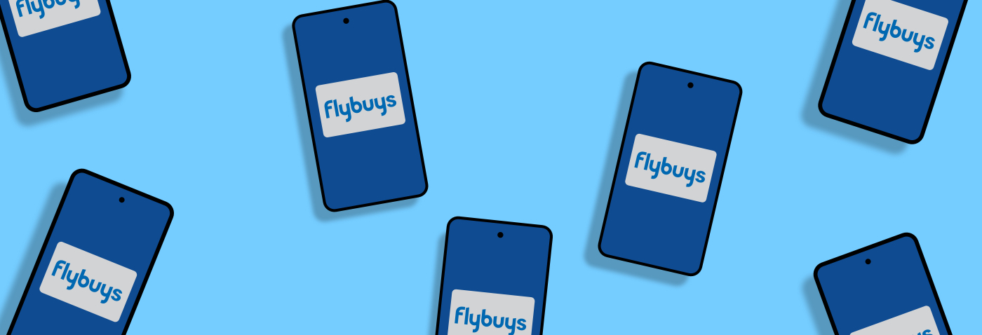 How to up your Flybuys game on the app Group of smartphones featuring Flybuys cards on screen