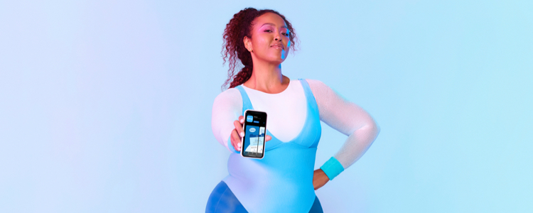 Women in lyra showing phone