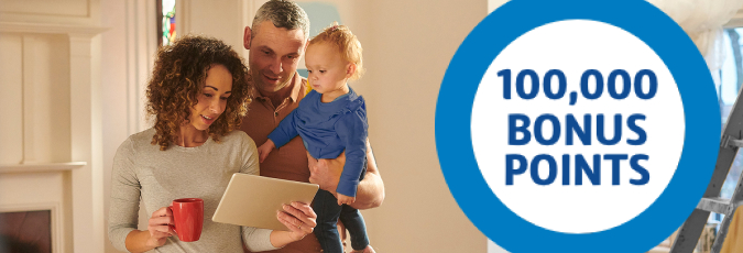 Enjoy 100,000 Flybuys bonus points with Citi Ready Credit Young family looking at tablet