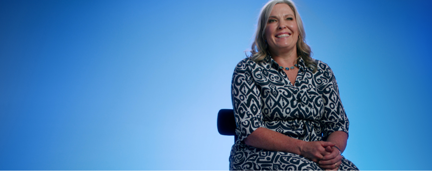 Flybuys 50 top 10 member Melinda sitting on chair