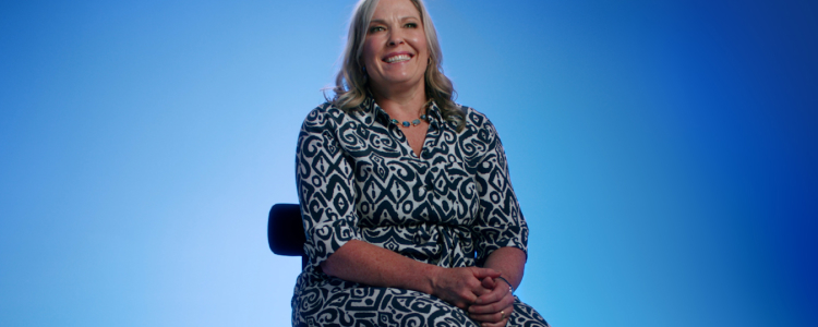 Flybuys 50 top 10 member Melinda sitting on chair