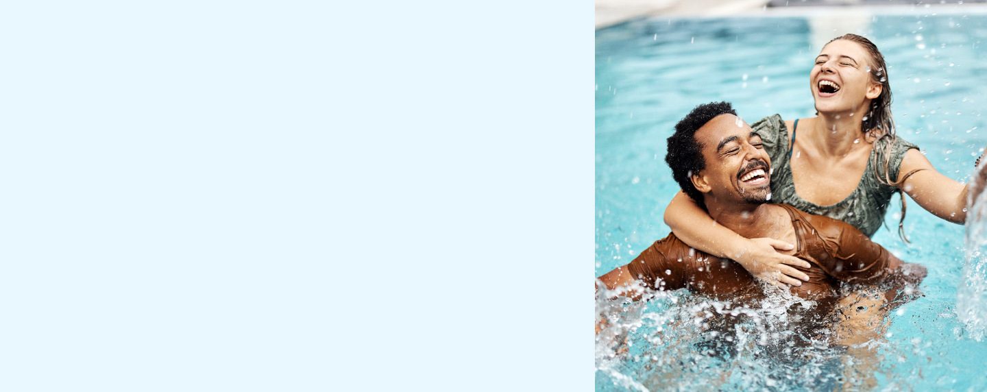 Young couple playing in the pool