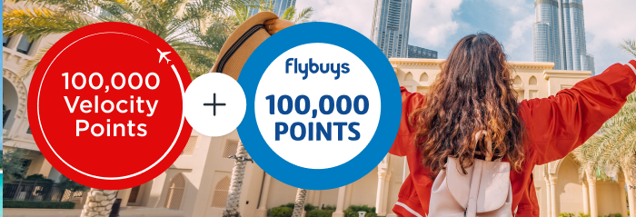 Join the 100K Points Parade now Excited female traveller with outstretched arms facing Burj Khalifa