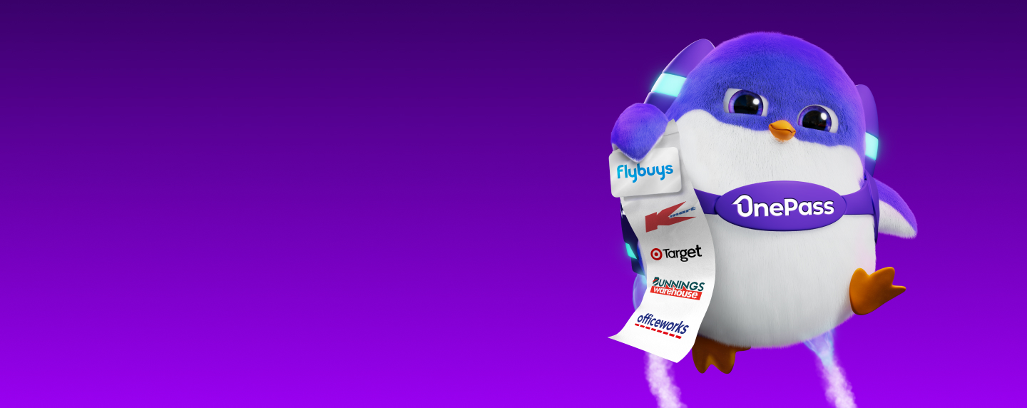 Onesie holds Flybuys card and docket displaying OnePass retailers
