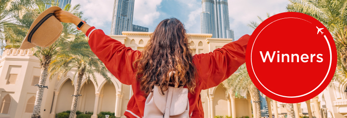 One girl facing the Dubai iconic landscape, Burj Khalifa, looks happy travelling and competition tagline 100K Points Parade 31 days 31 winners plus 100K Flybuys points roundel + 100K Velocity Points roundel