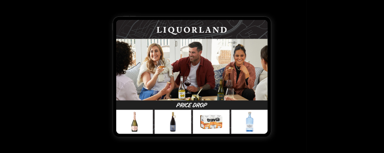 Friends enjoying a glass of wine on the couch and a selection of alcoholic beverages