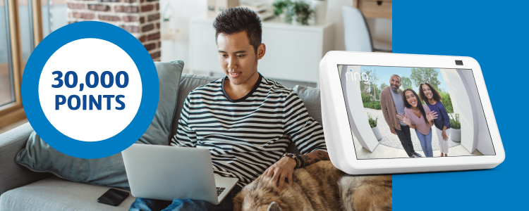 Amazon Echo next to man chilling on couch next to his dog and