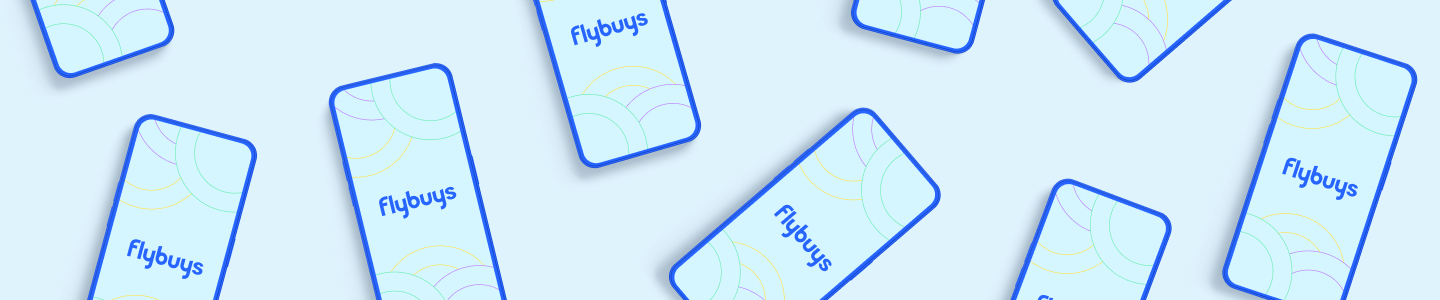 Flatlay of phones with Flybuys logos displayed on their screen