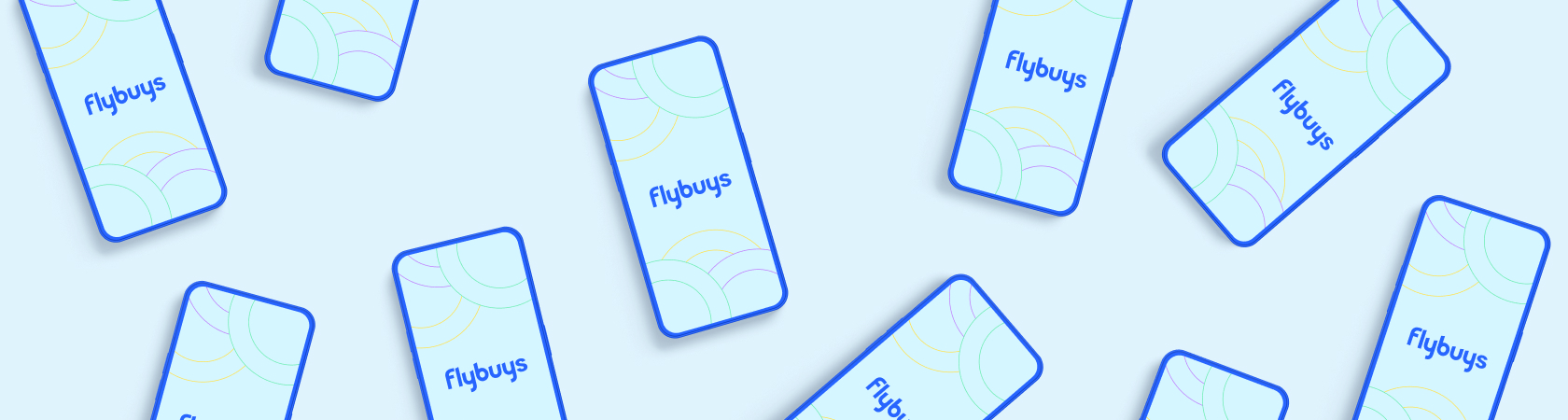 Flatlay of phones with Flybuys logos displayed on their screen