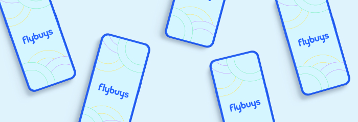 Flatlay of phone with Flybuys logo displayed on their screen