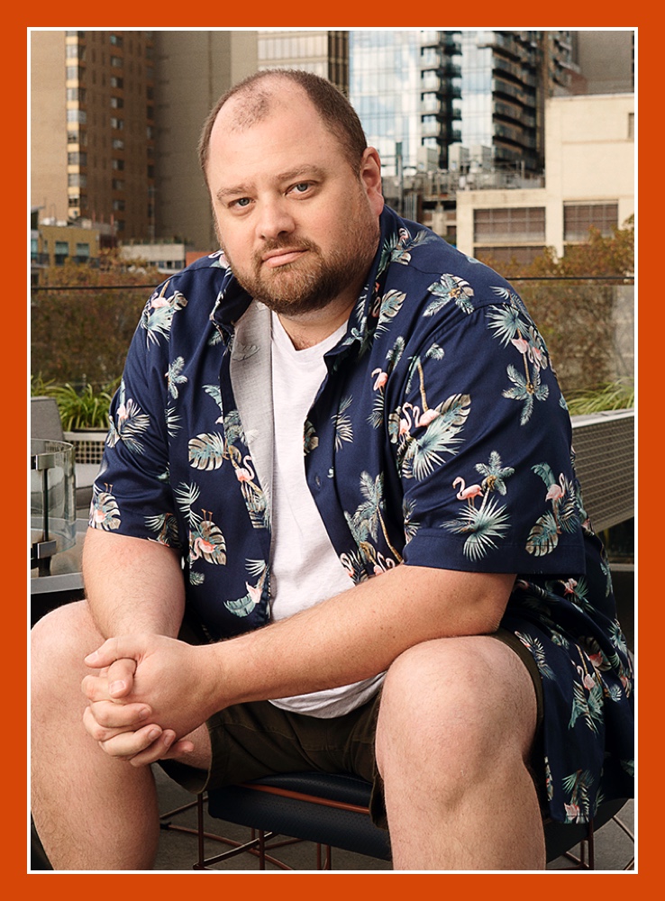 Flybuys' top 10 member Dale sitting down and holding his hands