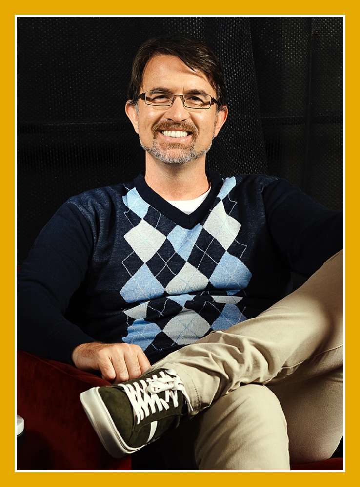 Flybuys' top 10 member Darian sitting down with legs crossed